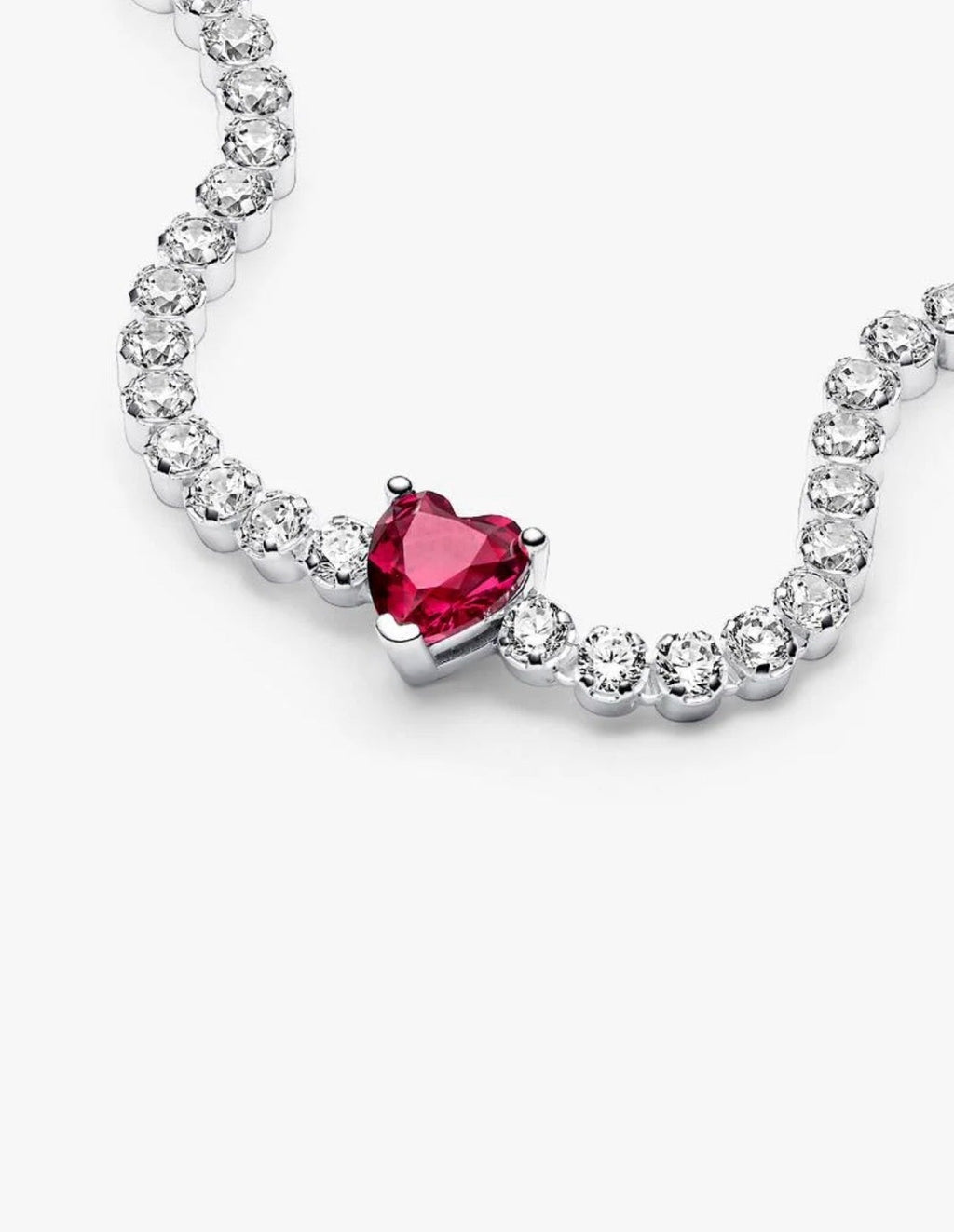 Red heart tennis bracelet close-up showing clear CZ stones and red heart cubic zirconia centerpiece